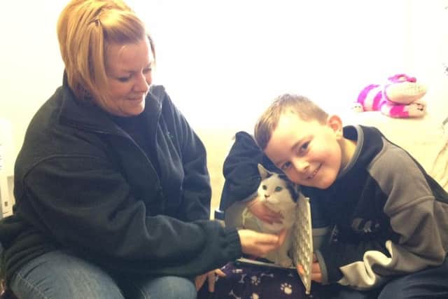 Vicky Bayley and her son Andrew with their new cat, Oscar.