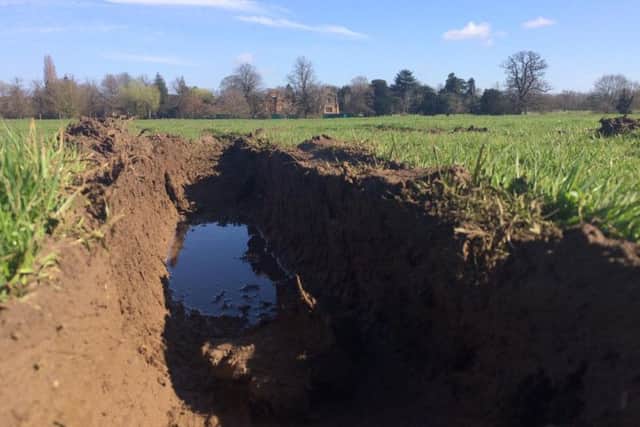The traveller's vehicles got stuck in the mud as they left and left deep gouges in the soil.