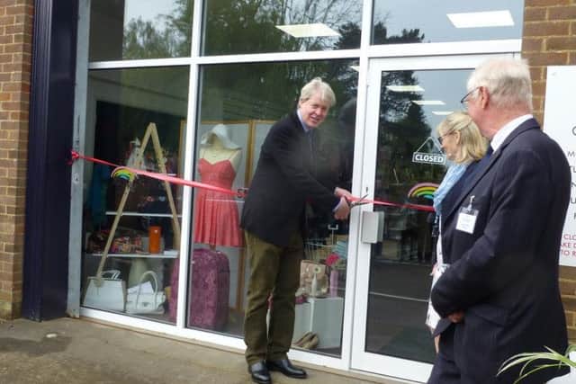 Lord Spencer cuts the ribbon.