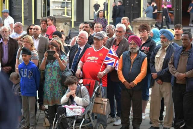 Over 100 people gathered to pay tribute to the victims of the Manchester terror attacks.