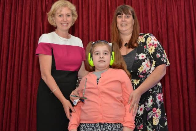 Sue Knox, from Wellingborough School, presents the Inspirational teacher award to Nicole Lawson, from Rowan Gate Primary School.