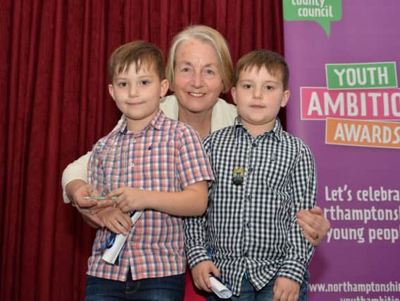 David & James Monk, Standens Barn Primary School winners of the Community Award, receive their award from the leader of Northamptonshire County Counci, Councillor Heather Smith