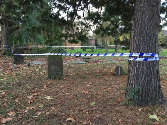 Police have taped off a churchyard in the centre of Northampton.