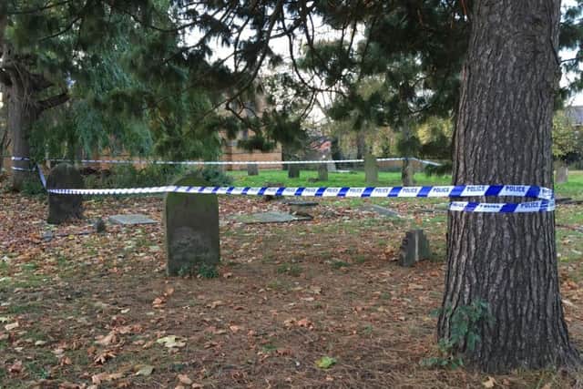 Police have taped off a churchyard in the centre of Northampton.