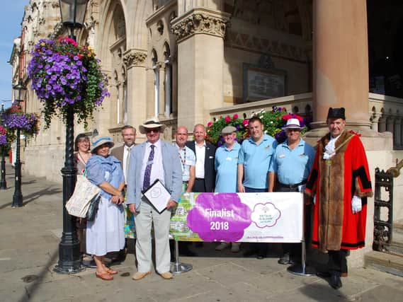 Britain in Bloom judges have toured Northampton as part of the town's bid to win one of the categories in the national competition.