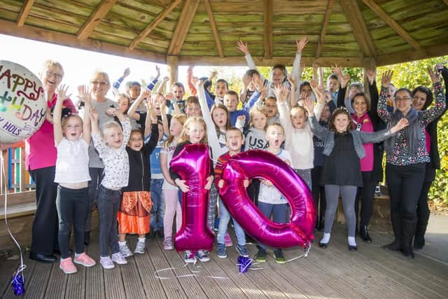 The Happy Hols play scheme is celebrating 10 years of doing things 'the old-fashioned way'.