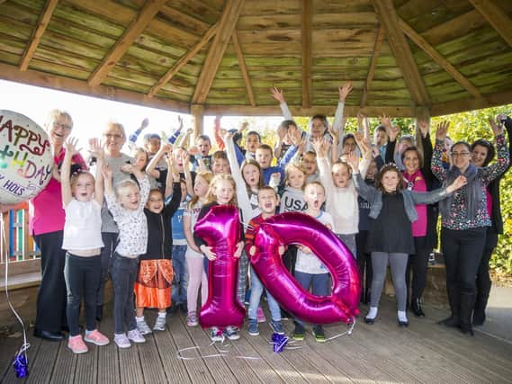 The Happy Hols play scheme is celebrating 10 years of doing things 'the old-fashioned way'.