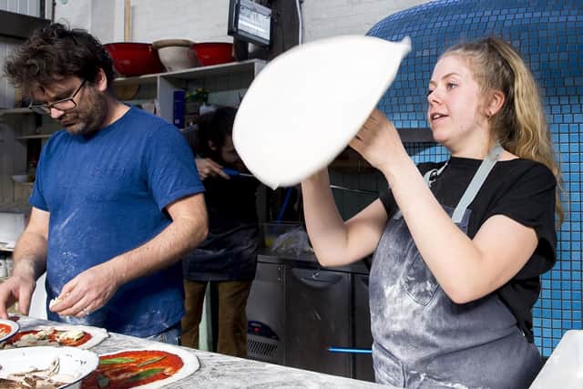 One of Market Houses first traders Rich Carver, who owns Honest Crust, started with a mobile pizza oven on the market at weekends. He now sells between 250 and 350 pizzas a day in Altrincham. Rich is pictured with Sarah Thrussell.