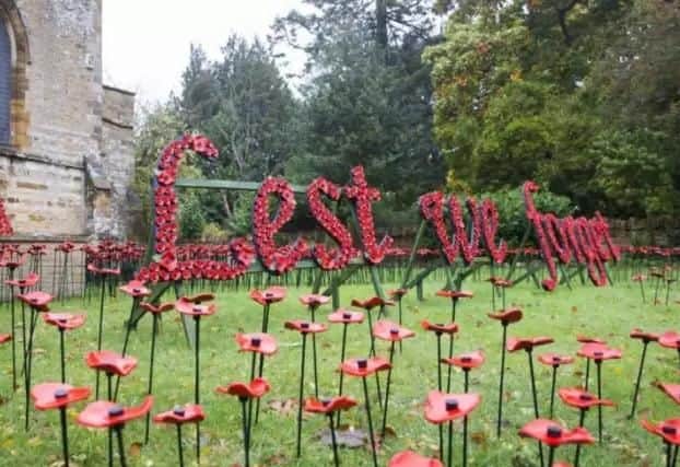 The ceramic poppy display at St Peter and St Paul's Church in Abington