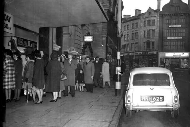 The queue for Adnitt's new year sale snakes down The Drapery, Northampton, on January 1, 1965