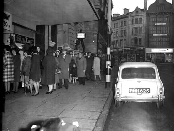 The queue for Adnitt's new year sale snakes down The Drapery, Northampton, on January 1, 1965