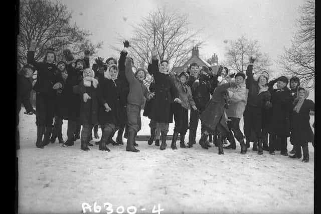 Children enjoy their task of snowballing in the direction of the photographer. The group in Abington Park, Northampton, wearing duffel coats, mufflers and wellington boots, were caught on film on January 12, 1959
