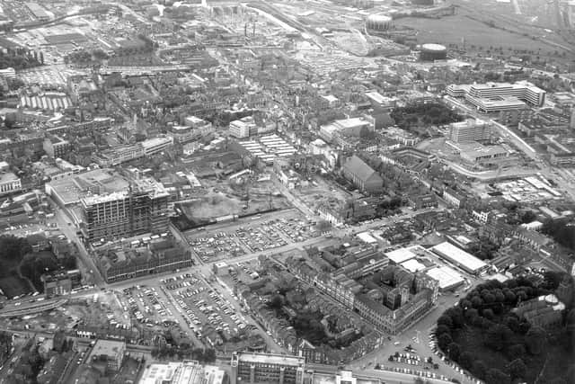 This aerial photograph of Northampton, taken in around 1972, reveals the extent of demolition that had taken place in the heart of the town leaving large swathes of car parking space: Ladys Lane runs from left to right (west to east).
In the far right hand corner is The Church of the Holy Sepulchre, surrounded by trees: top middle is the modern Carlsberg Brewery.