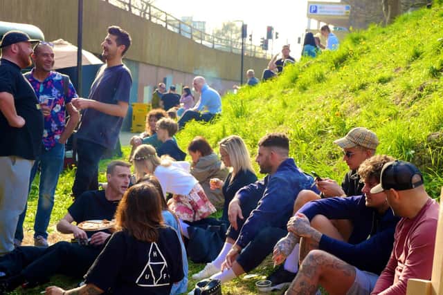 The underpass' grassy verge - dubbed 'Chill Out Hill' - became a great spot to soak up some sun.