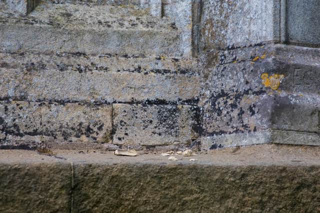 One concerned historian spotted chips of stone on the base of the cross where it had crumbled off.