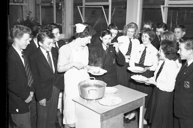 Pupils testing a rather watery-looking soup at Duston Secondary Modern School, Northampton in December 1959