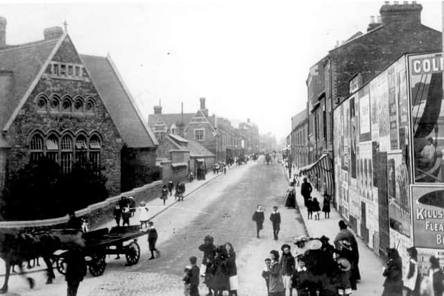 Men, women and children in the street next to John Clare School (now base for Northamptonshire Music & Performing Arts Trust) on Clare Street/Kettering Road junction