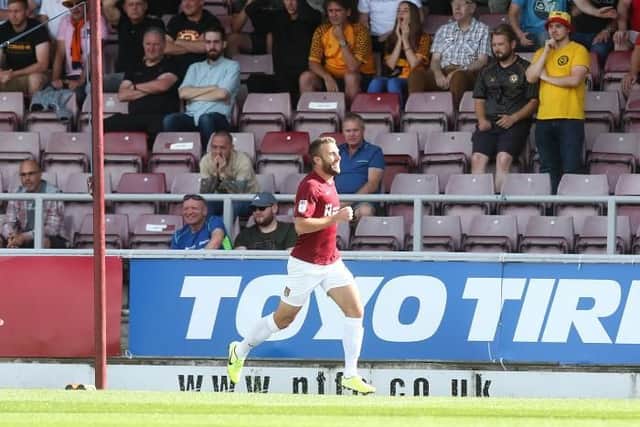 Andy Williams celebrates firing the Cobblers into the lead