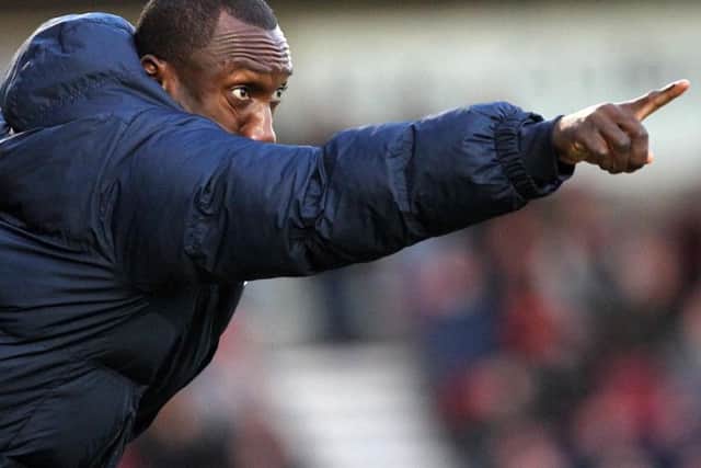 Cobblers boss Jimmy Floyd Hasselbaink points the way