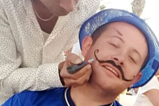 Arran Maye in Benidorm where he had the henna moustache.