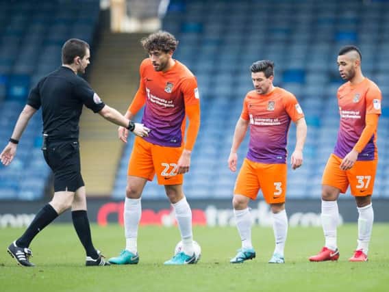 Matt Crooks, Dave Buchanan and Lewis McGugan weigh up the Cobblers' options at a free-kick in the 2-0 loss at Portsmouth (Pictures: Kirsty Edmonds)