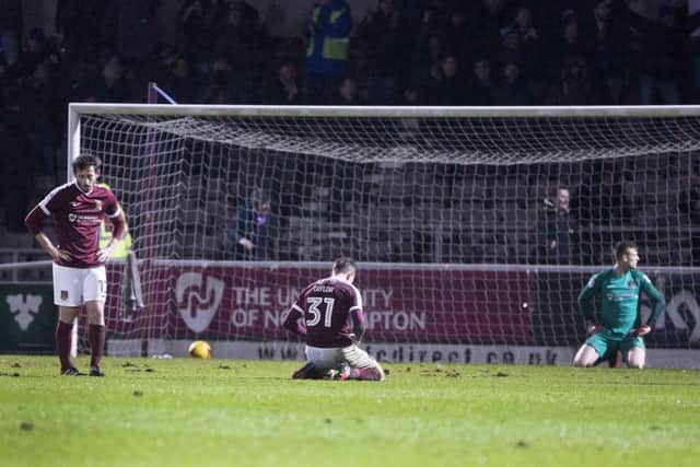 FORGETTABLE NIGHT: Cobblers players were left crestfallen by Oldhams late winner at Sixfields back in March