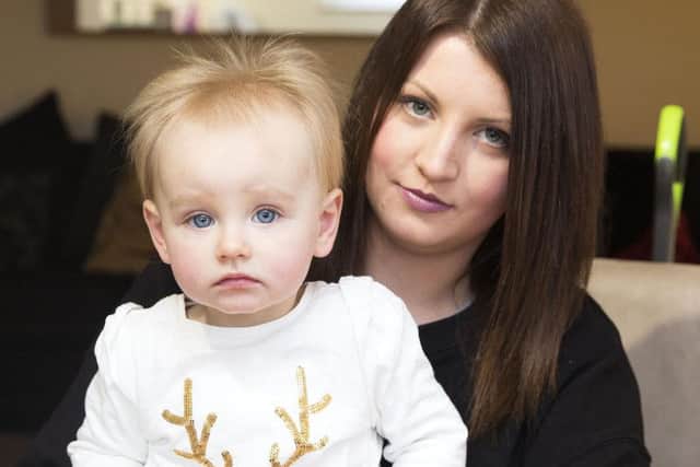 Emma McKenzie and her baby, Heidi rely on the 33/33A bus service at Hartwell, which is likely to be cut.