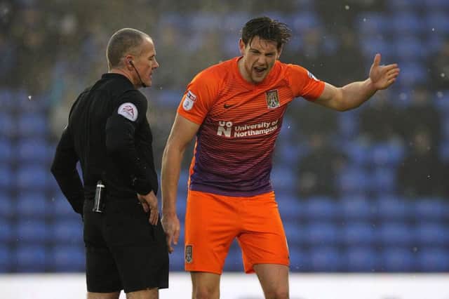 NOT HAPPY - Ash Taylor shows his frustration as a decision goes against the Cobblers at Oldham (Picture: Sharon Lucey)