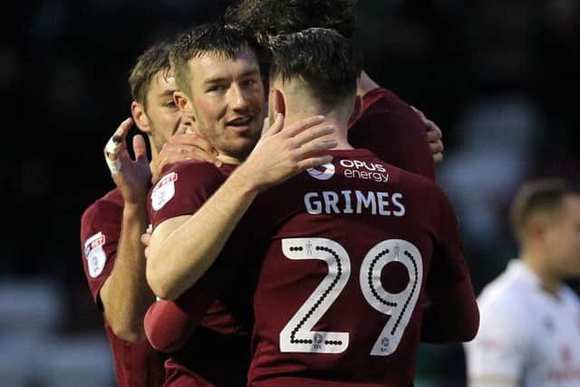 Chris Long celebrates firing the Cobblers into a 2-1 lead (Pictures: Sharon Lucey)