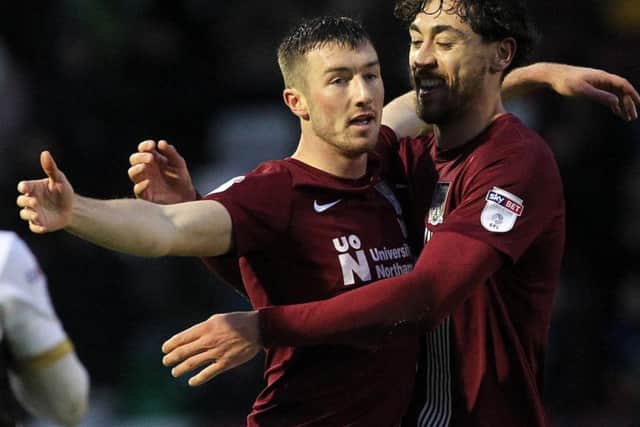 Chris Long celebrates his second goal with Matt Crooks