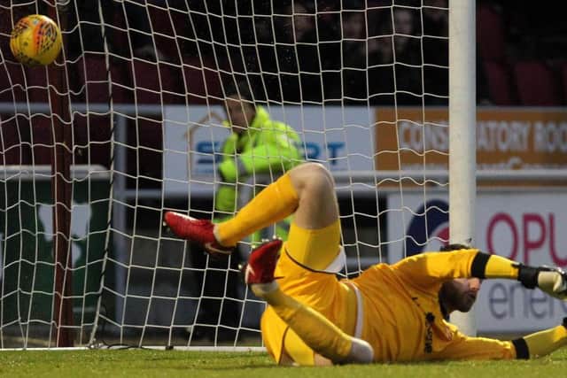 Chris Long's shot flies into the net to put the Cobblers 2-1 up