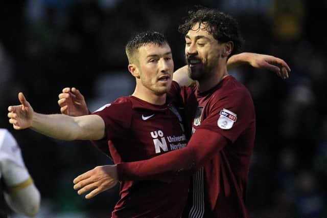 Chris Long celebrates his second and match-winning goal with Matt Crooks. Pictures: Sharon Lucey