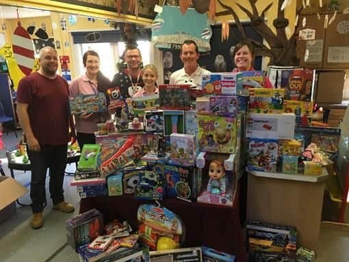 Amazon staff hand over the presents at Northampton General Hospital