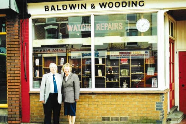 Colin with wife, Melva pictured outside their shop.