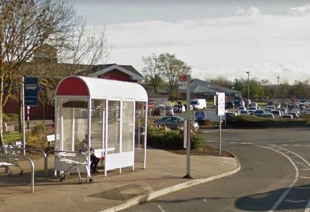 A woman was dragged to the floor by robbers during an attack near the Tesco Mereway petrol station.