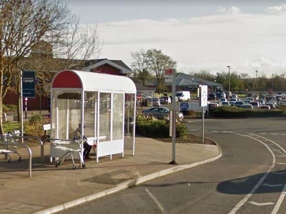 A woman was dragged to the floor by robbers during an attack near the Tesco Mereway petrol station.