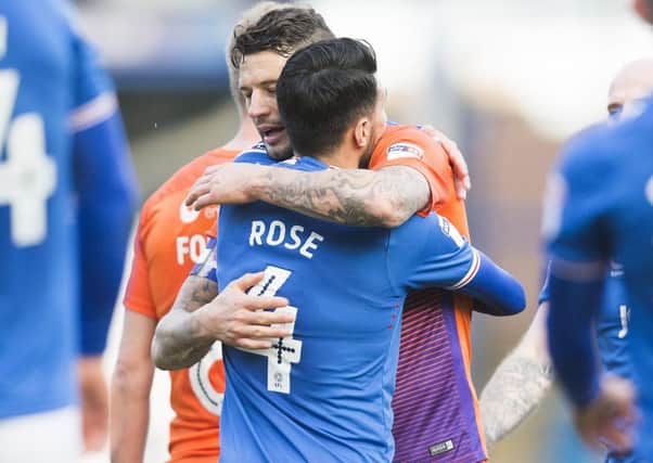 Danny Rose embraces Marc Richards following Portsmouth's Checkatrade Trophy win over the Cobblers earlier this month