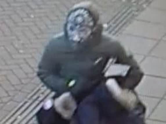 This man was seen running out of a store in Wellingborough Road following a robbery.