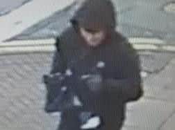 One of the suspects removed his mask as he fled from the scene.