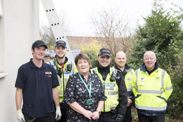Pictured L-R: Electrician, Martin Hair, PCSO James Wetherall, Theresa Kelly of NAASH, PC Lee Stevens with neighbourhood warderns, Steven Burdett and Robert Strickland.