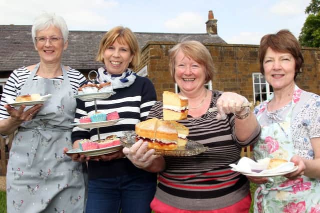 Taken in 2014, WI members Ann Cotton, Monique Shortt, Kate Earley and Heather Piper serving tea and cakes to the bluebell walkers in Badby
