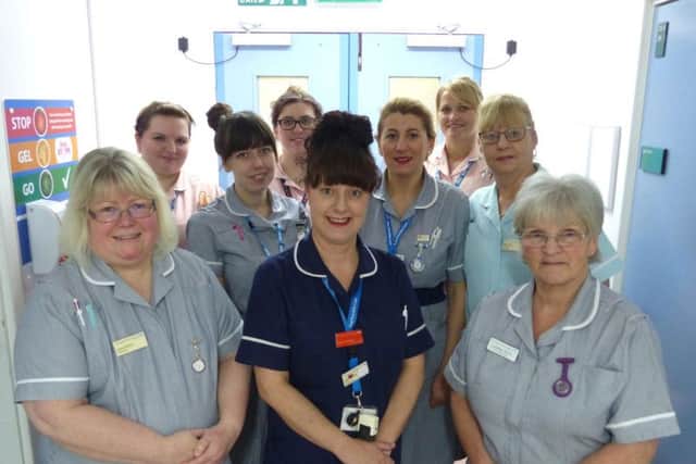 Pictured: Sarah Dainty (centre) with her team on Spencer Ward at Northampton General Hospital.