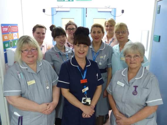 Pictured: Sarah Dainty (centre) with her team on Spencer Ward at Northampton General Hospital.