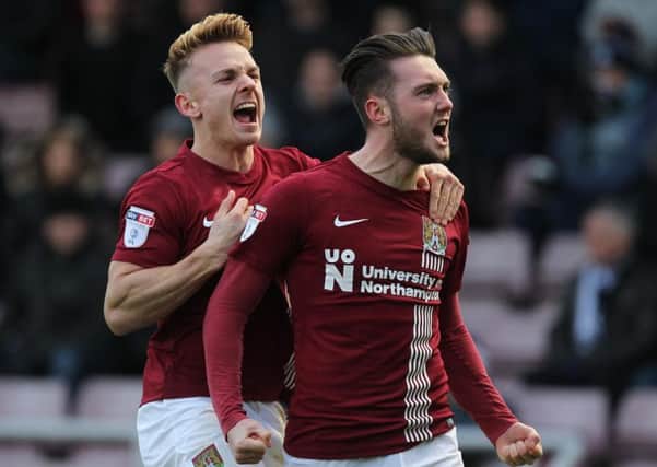 Matt Grimes celebrates after hammering home the penalty that saw the Cobblers take a 2-1 lead against Southend United on Saturday