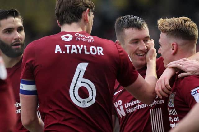 CHEERS MATE! - Chris Long thanks Sam Hoskins after he set up his match-winning goal at Sixfields (Pictures: Sharon Lucey)