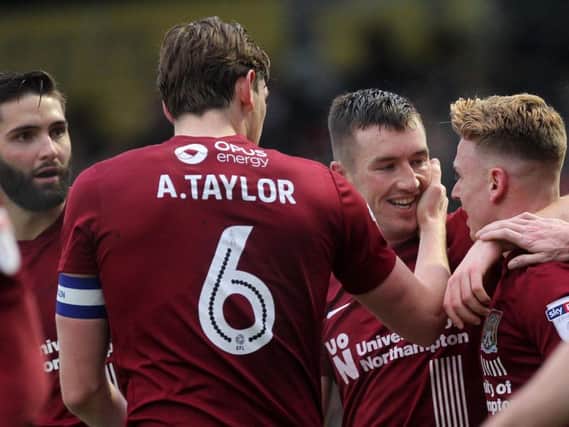 CHEERS MATE! - Chris Long thanks Sam Hoskins after he set up his match-winning goal at Sixfields (Pictures: Sharon  Lucey)