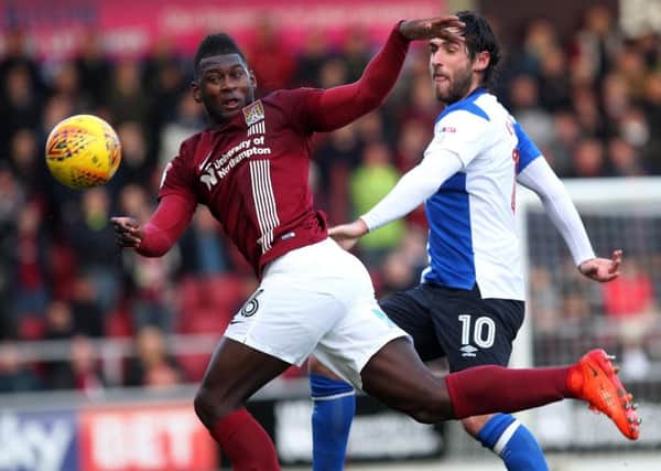 Danny Graham tussles with Cobblers defender Aaron Pierre in the 1-1 draw at Sixfields in December