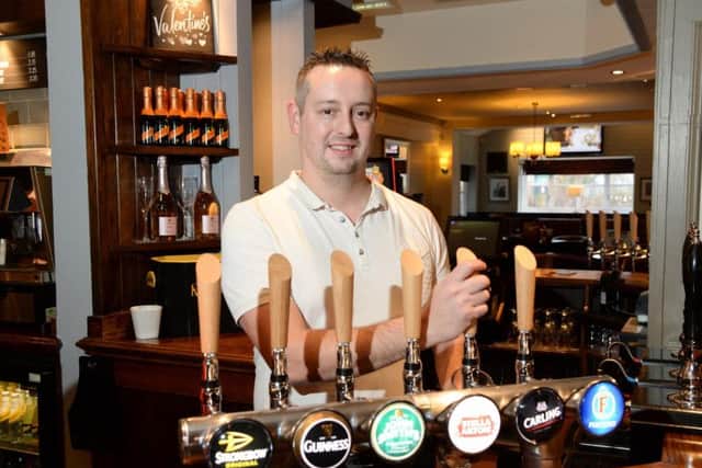 Carl Bruce, the new general manager at the Quays, pulls the first pint