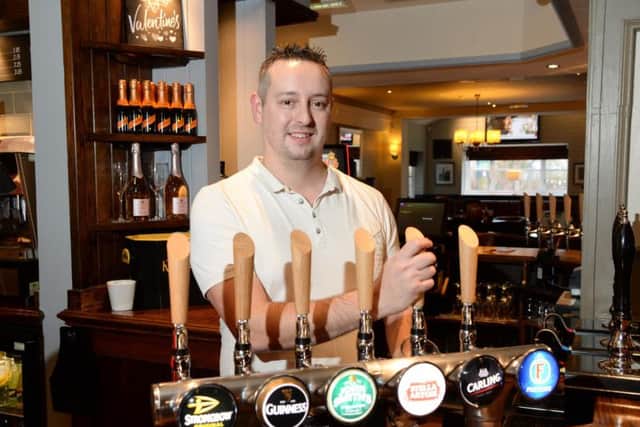 Carl Bruce, the new general manager at the Quays, pulls the first pint