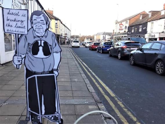 A paper protester campaigning against diesel air pollution has appeared in Wellingborough Road.